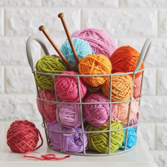 Colourful yarns and knitting needles